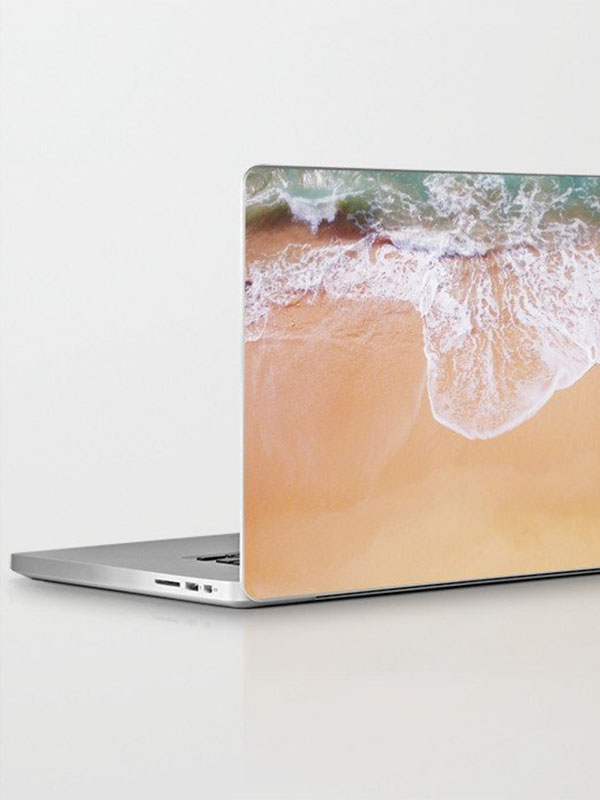 MacBook Pro skin zand en zee - Reislegende.nl